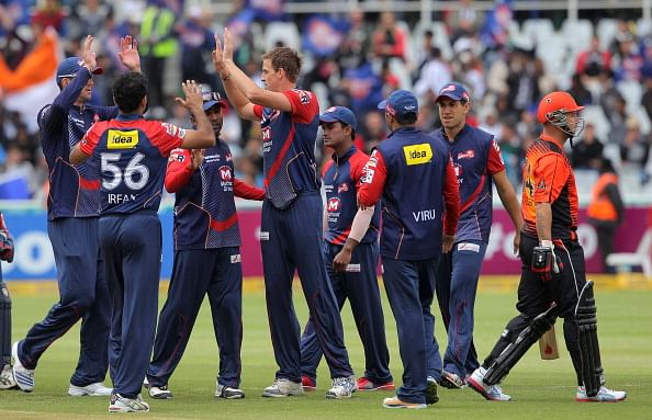 CAPE TOWN, SOUTH AFRCA - OCTOBER 21: Herschelle Gibbs (R) of Perth Scorchers is bowled by Morne Morkel (C) of the Delhi Daredevils during the Champions league twenty20 match between Perth Scorchers and Delhi Daredevils at Sahara Park Newlands on October 21, 2012 in Cape Town, South Africa.